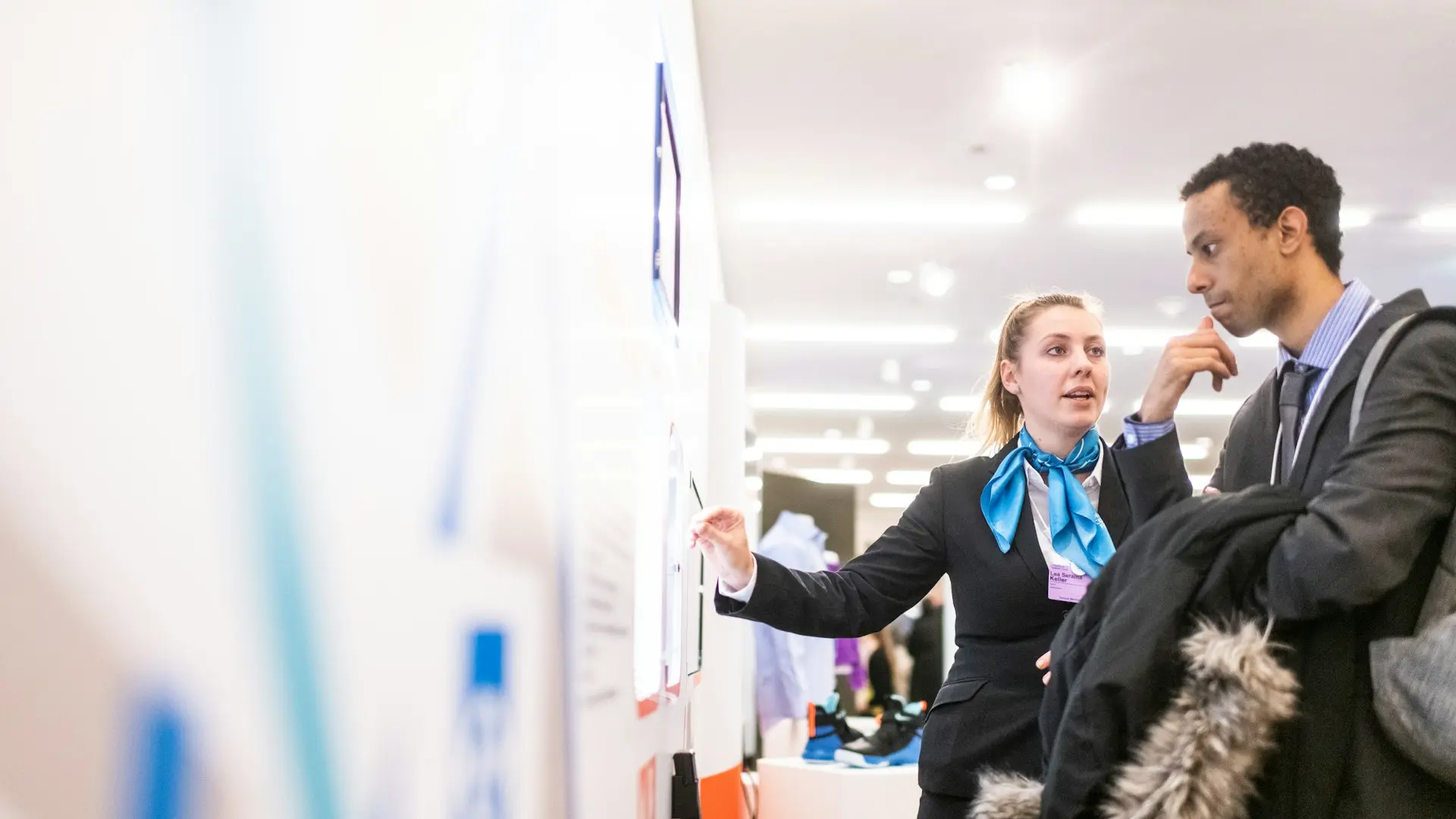 man and woman talking near the wall