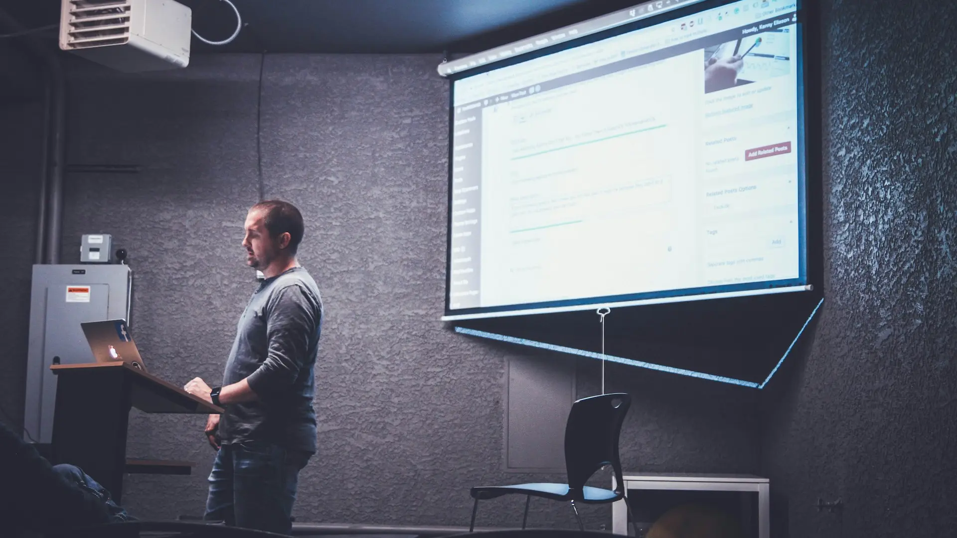 person standing in front of brown lectern