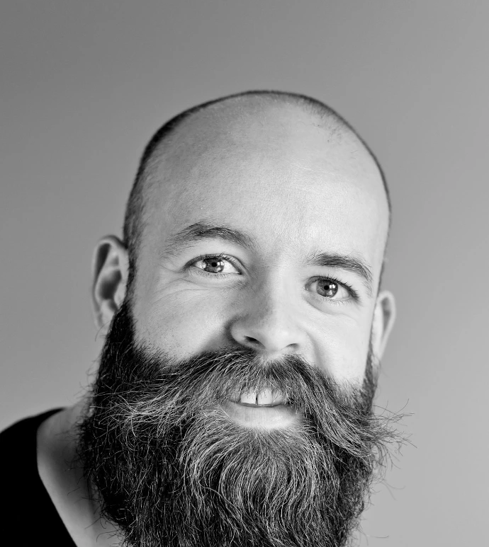 grayscale photography of man wearing crew-neck shirt